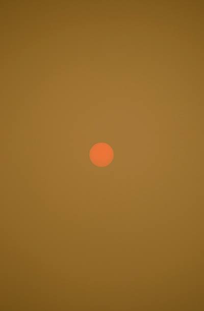 orange sun in a yellow sky