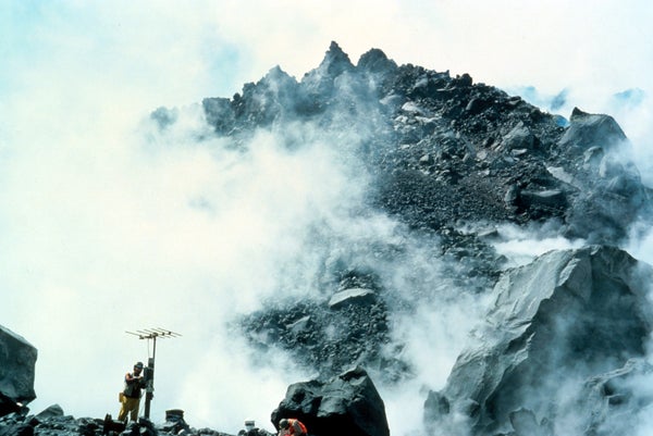 Geologist monitoring seismic station set up on the north side of Mount St. Helens's crater dome. This is in May of 1981, and the volcano is still very much active. Volcanologists are incredibly courageous people. Public domain image by Lyn Topinka/USGS.