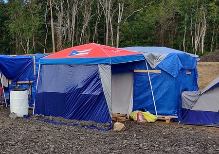 Refugee tents set up in a gravel lot in Puerto Rico