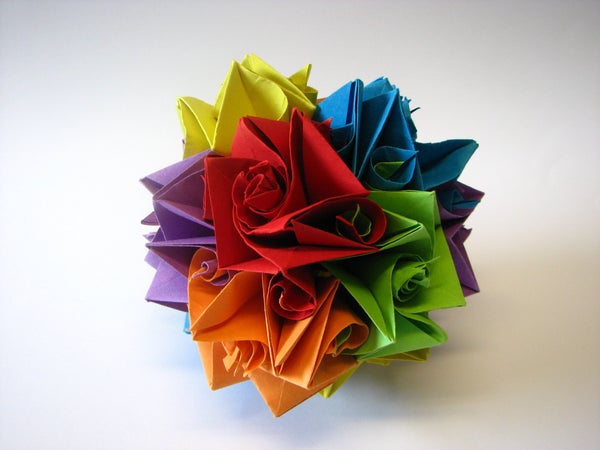 A multi-colored origami piece with many swirled pieces