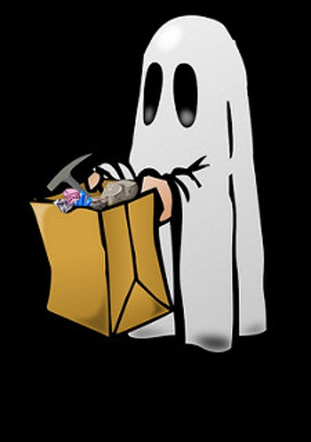 Image is a cartoon of a ghost holding a paper trick-or-treat bag filled with rocks, gems, and a rock hammer.