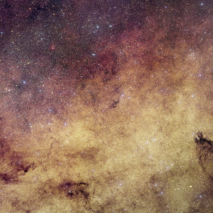 Milky Way center picked out in purple and gold