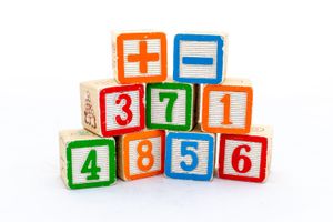 Colorful number blocks are stacked into a pyramid missing the top.