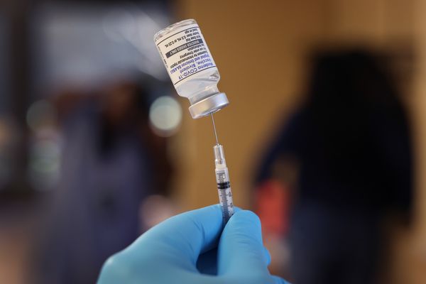 A pharmacist prepares to administer COVID vaccine booster shots during an event hosted by the Chicago Department of Public Health at the Southwest Senior Center in Chicago on September 9, 2022.