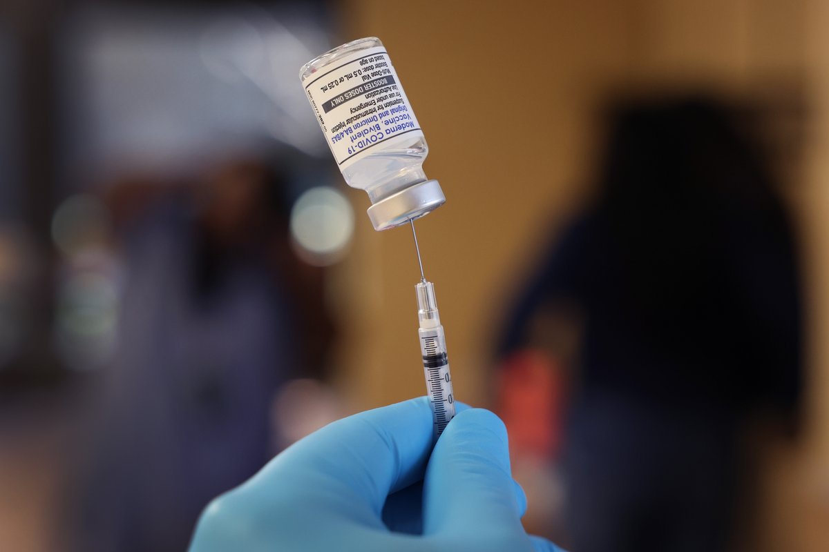 A pharmacist prepares to administer COVID vaccine booster shots during an event hosted by the Chicago Department of Public Health at the Southwest Senior Center in Chicago on September 9, 2022.
