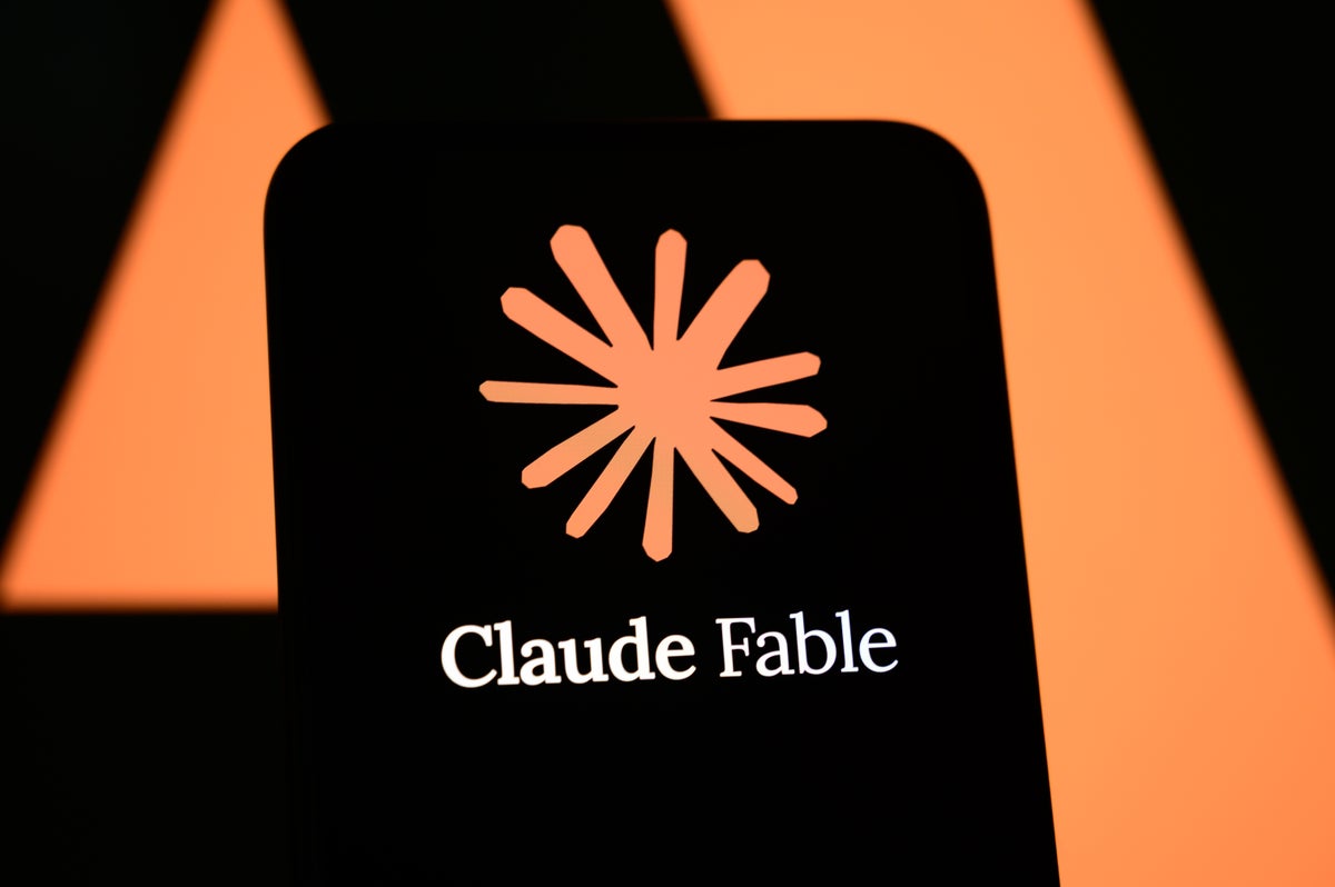 A smartphone screen displays the Claude Fable logo against an orange and black backdrop.