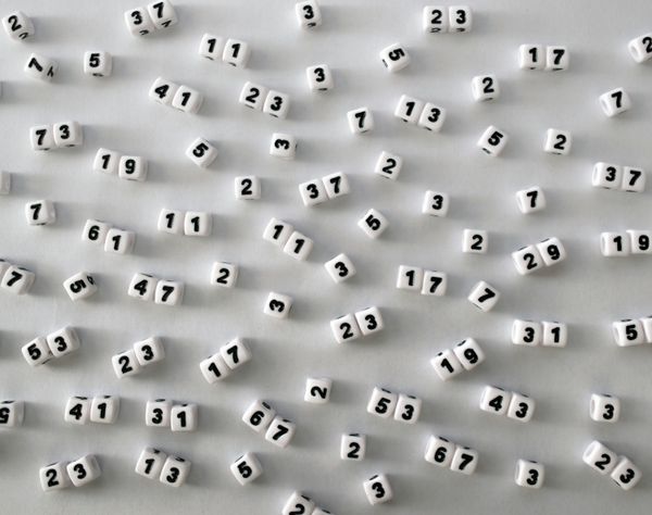 Dice arrayed connected a achromatic aboveground displaying galore premier numbers.