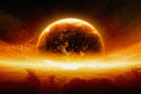 Abstract apocalyptic background showing a burning and exploding planet Earth in an orange-red sky.