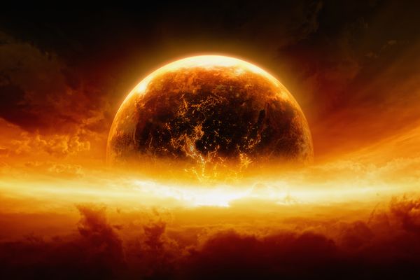 Abstract apocalyptic background showing a burning and exploding planet Earth in an orange-red sky.