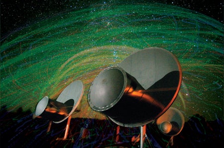 A radio telescope with a starry background.