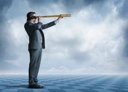 A blindfolded man seen in profile attempts to gaze into the distance through a spyglass. Ominous clouds fill the background.