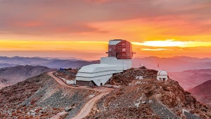 Vera C. Rubin Observatory in the foreground, against a rose-gold sky.