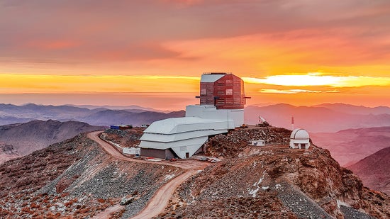 Vera C. Rubin Observatory in the foreground, against a rose-gold sky.