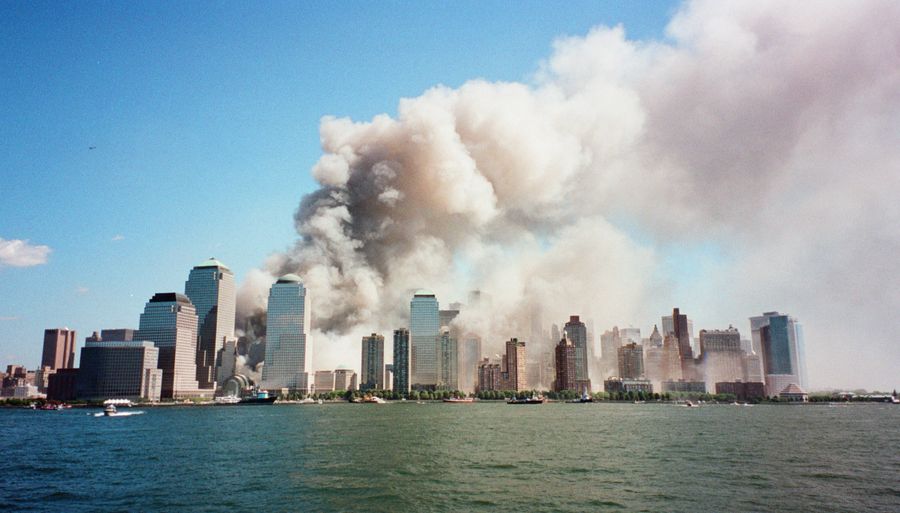 A cloud of smoke billows above lower Manhattan.