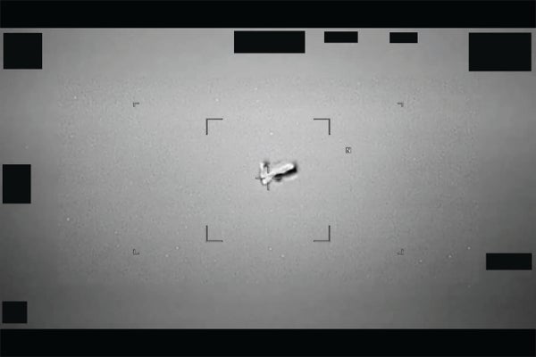Black-and-white image of a football-shaped object in the sky spotted near Japan