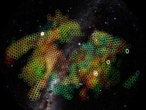 A panoramic view of a swath of Earth's night sky, overlain by thousands of small color-coded circles each representing a single exposure planned for the Vera C. Rubin Observatory.