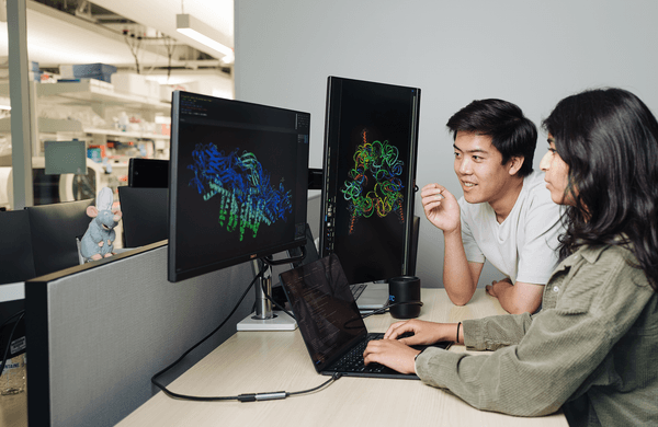 Brian Hie and Aditi Merchant analyse a macromolecule building generated by Evo 2, an AI instrumentality that tin propose genome designs. Lab tests of Evo 2’s designs for an E. coli slayer exceeded expectations.