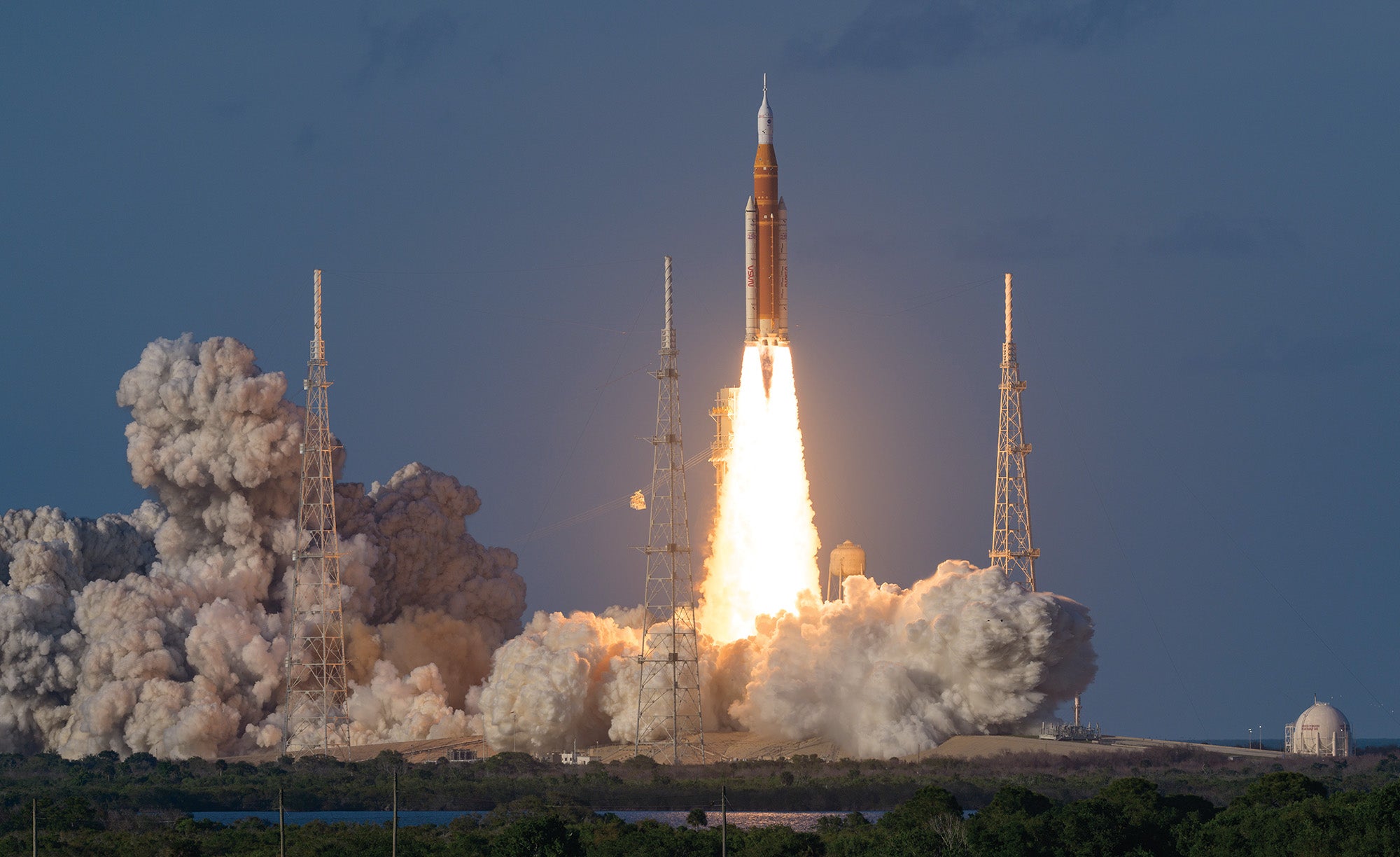 NASA’s Space Launch System rocket launches on a fiery pillar of exhaust surrounded by billowing clouds, sending the Orion crew capsule of the space agency’s Artemis II lunar mission into orbit.