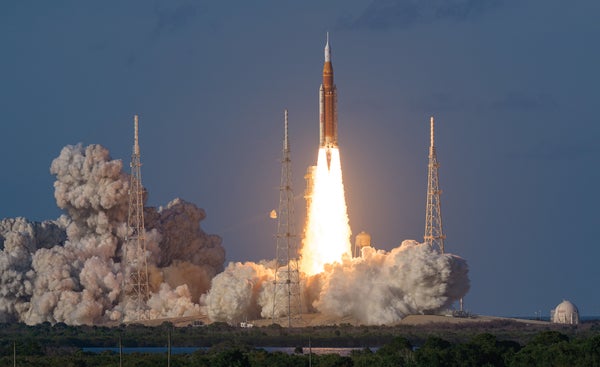 NASA’s Space Launch System rocket launches on a fiery pillar of exhaust surrounded by billowing clouds, sending the Orion crew capsule of the space agency’s Artemis II lunar mission into orbit.