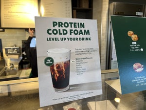 Close-up of sign for Protein Cold Foam drink addition at a Starbucks cafe