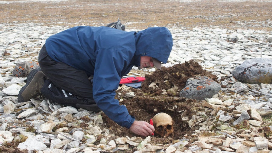 University of Waterloo archaeologist Douglas Stenton excavating remains at Erebus Bay in 2013. This cache of bones included those of the newly-identified John Bridgens.