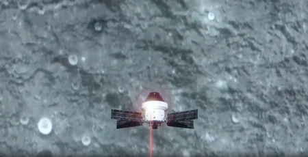 In this animated video, a knob-shaped space craft with solar panels attached in an X-shape (the Orion capsule) flies over the moon's surface.