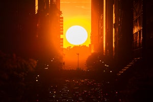 The setting sun in between skyscrapers in Manhattan