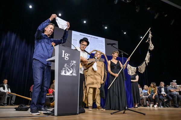 Ig Nobel Soil Science prize winners (From L) Marcel van der Heijden, Franz Bender, Atlant Bieri and Pia Viviani reacts on stage during the award ceremony in Zurich, on September 3, 2026. The team were awarded "for burying 1000 identical pairs of underpants in more than 25 countries, and then digging them up after two months".