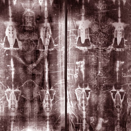 This black and white image shows the front and back of the Shroud of Turin linen cloth bearing the image of a bearded man that some claim to be the burial shroud of Jesus of Nazareth.