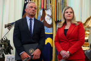 Secretary of Health and Human Services Robert F. Kennedy, Jr. (left) and Deputy Assistant to the President for Domestic Policy Heidi Overton (right) stand in the Oval Office after U.S. President Donald Trump signed an executive order calling for childhood vaccine shots to be spaced out into separate visits at the White House on August 10, 2026, in Washington, D.C.