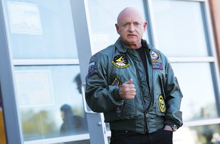 Portrait photograph of Mark Kelly provided by Kevin Dietsch/Getty Images.