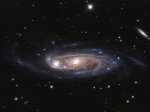 A photograph of a giant spiral galaxy in deep space