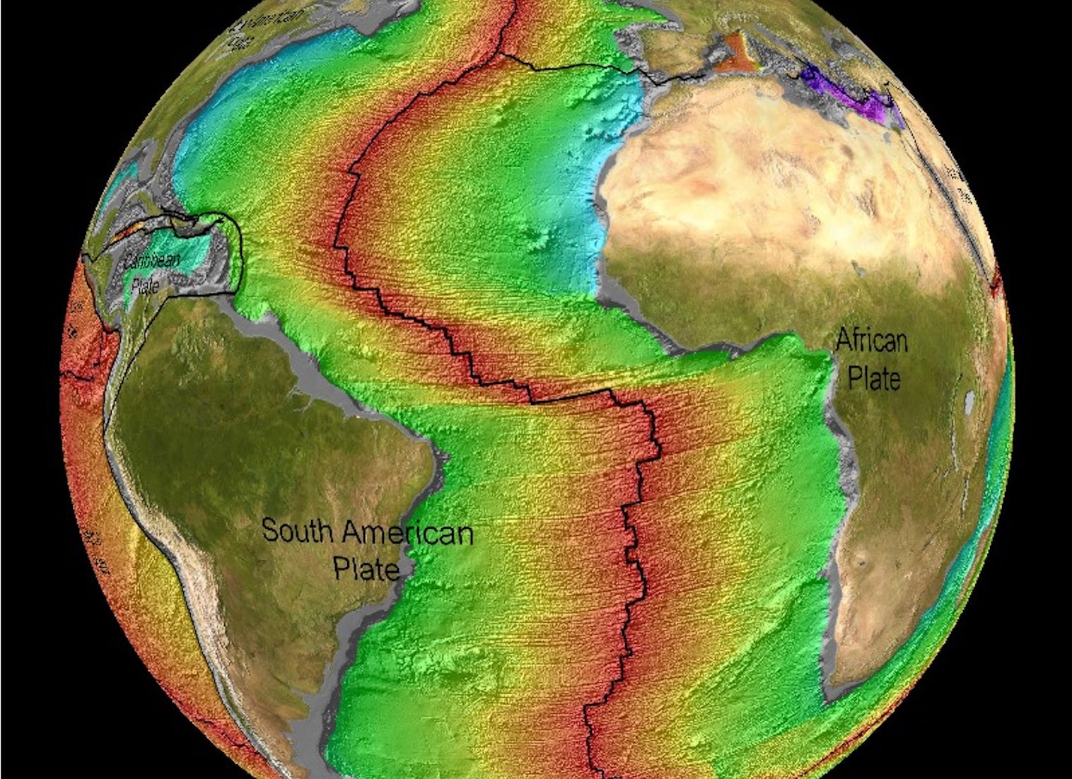A colorized view of part of the globe of Earth showing South American, Africa and parts or North America and Europe. A jagged red line runs down the Atlantic Ocean basin showing where a mid-ocean ridge is