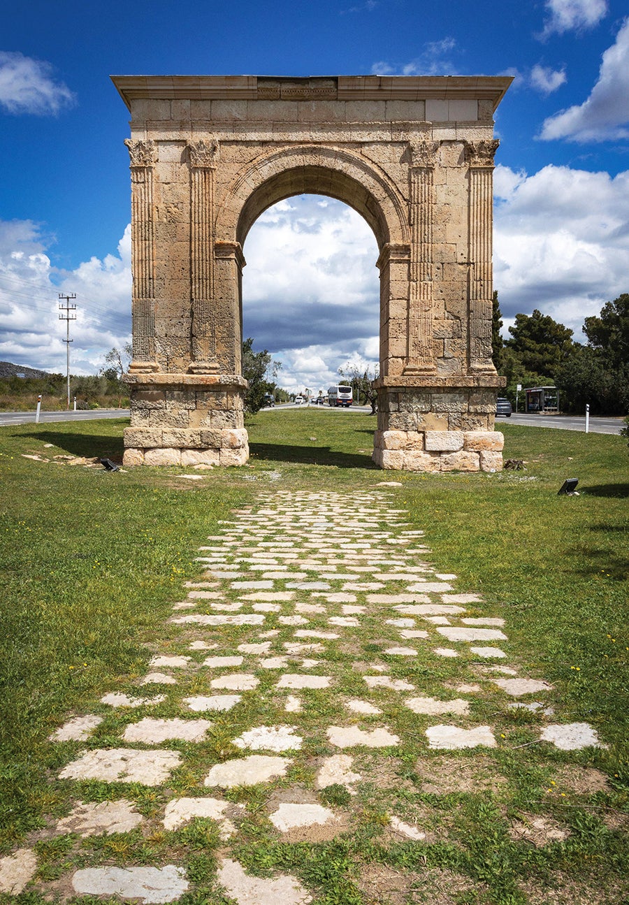 A stretch of the Via Appia showing the straight construction and stone paving associated with classic Roman roads.