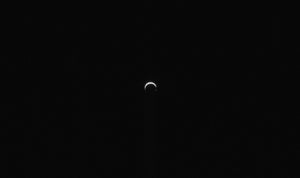 A small bright crescent against blackness.