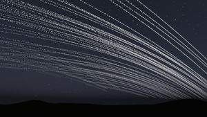 An animation showing bright rings of orbital data center satellites passing through the sky shortly after sunset.