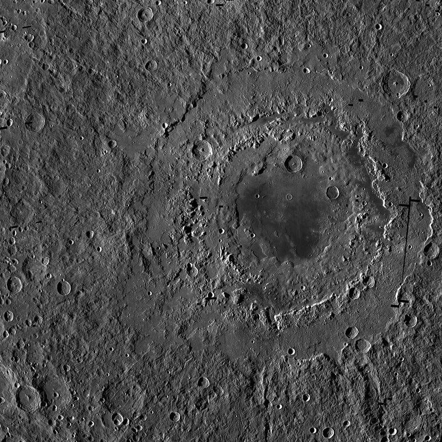A gray landscape with a dark spot ringed by three walls in the center.