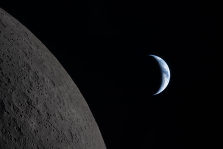 To the left, the gray, cratered surface of the moon. To the right, a crescent Earth.