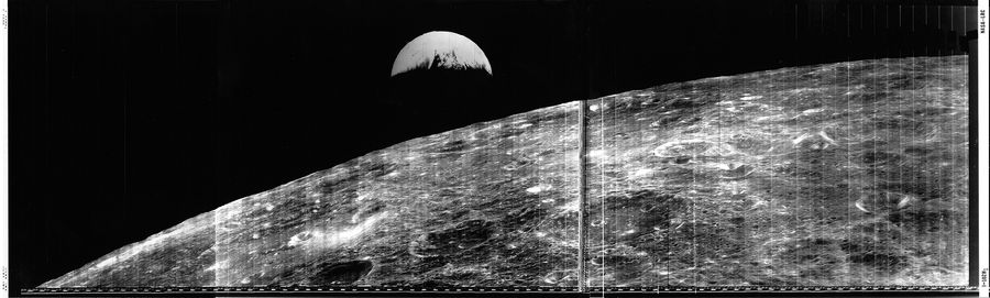 A view of the moon and a crescent Earth from Lunar Orbiter 1.