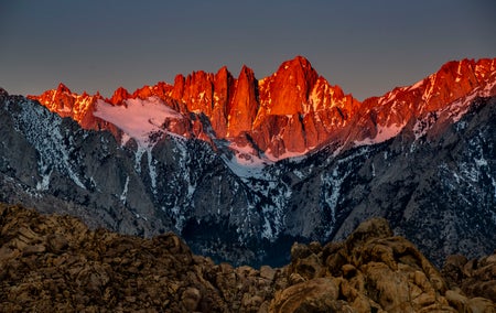Mountains seen at sunrise with only small amounts of snow