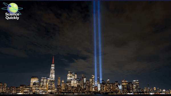 An image of 9/11 light tribute of twin beams shining in New York City's night skyline.