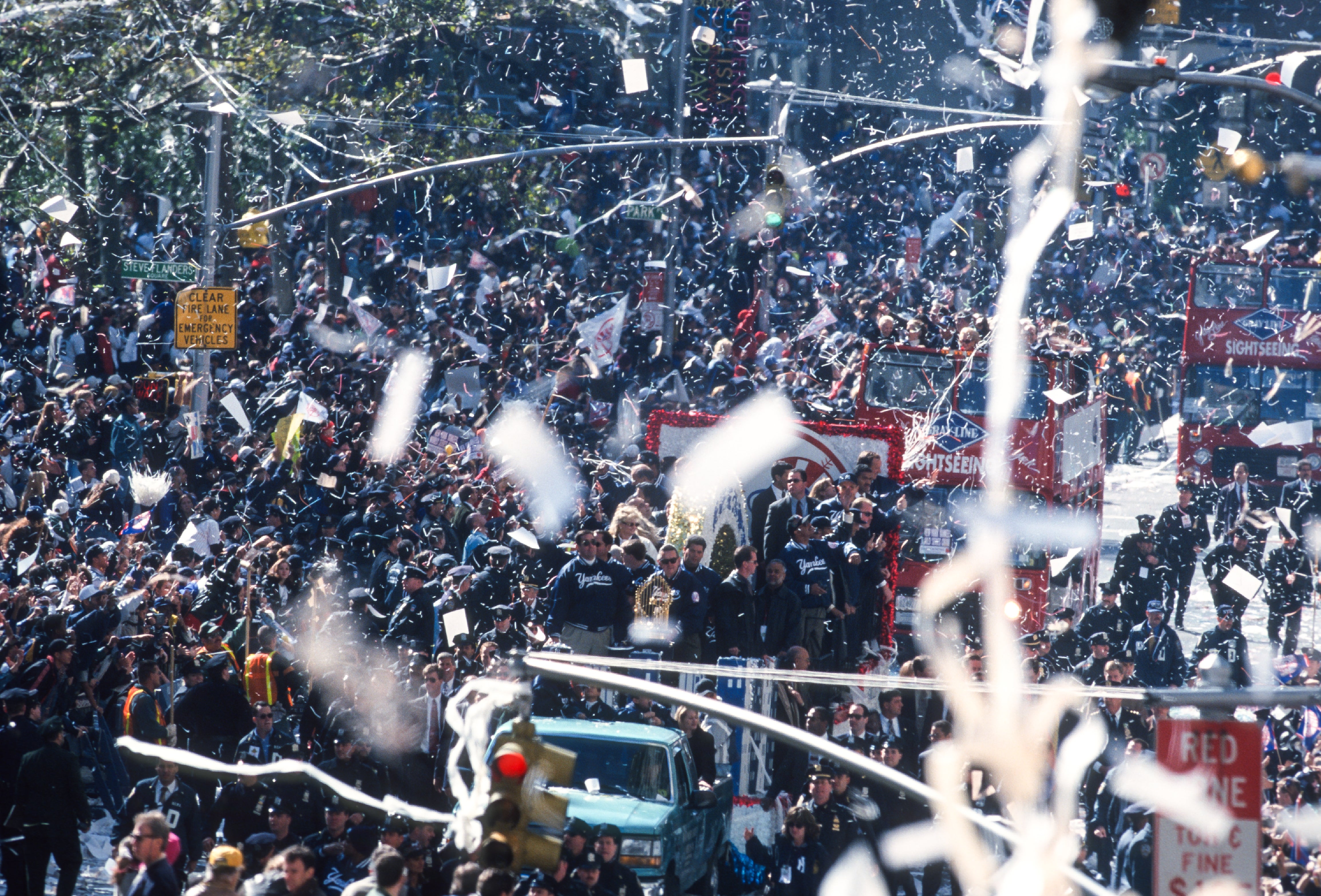 Ticker-tape parade confetti in front of a crowd.