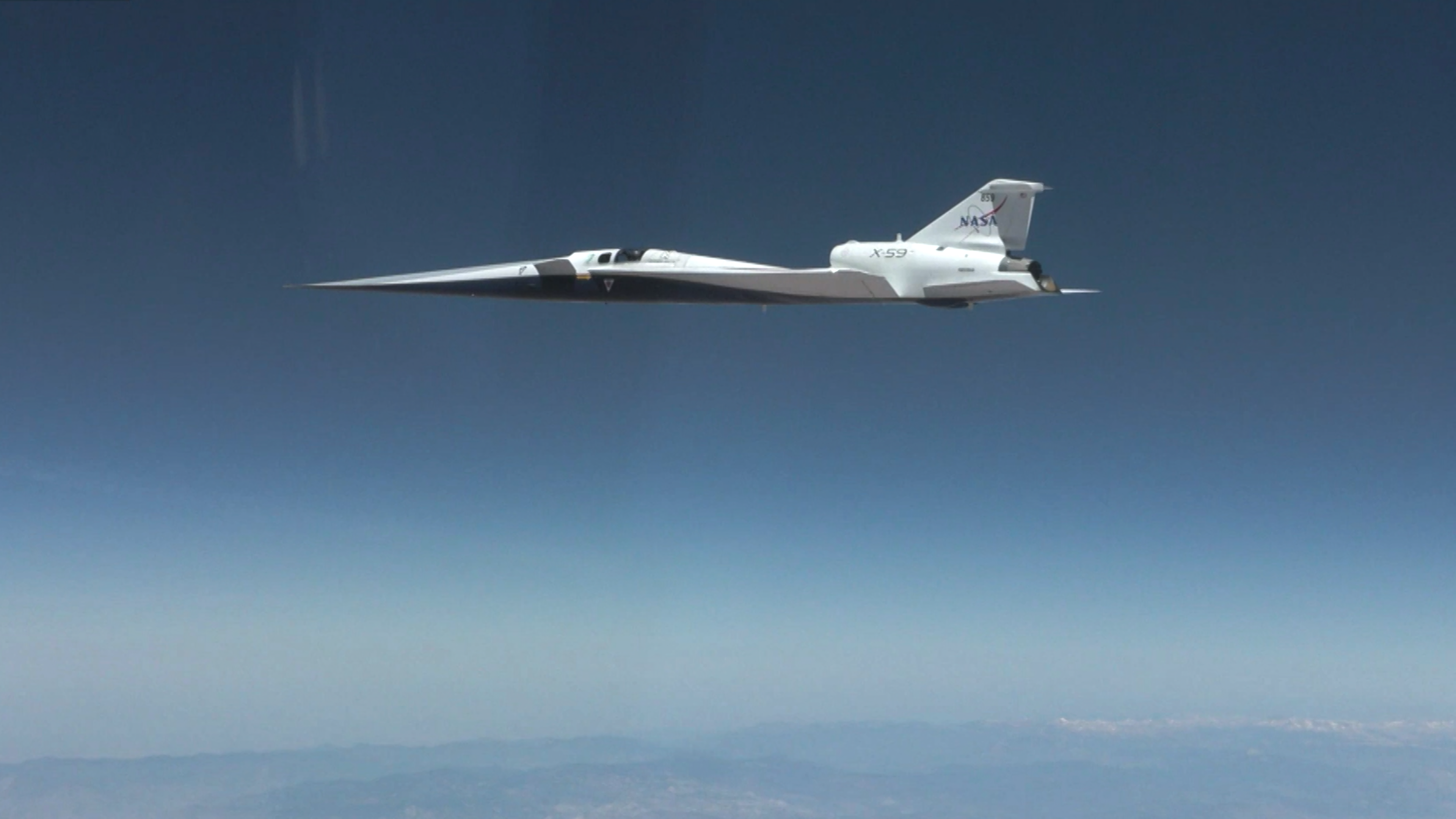 A soaring plane with an exceptionally pointy nose and X-59 written on the tail.
