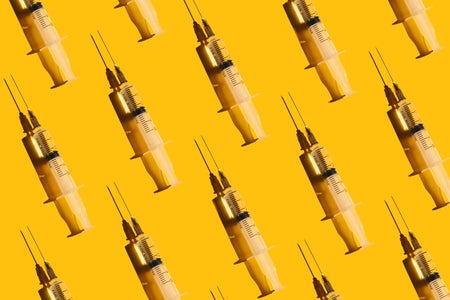 syringes on a yellow background to illustrate peptide injections for wellness