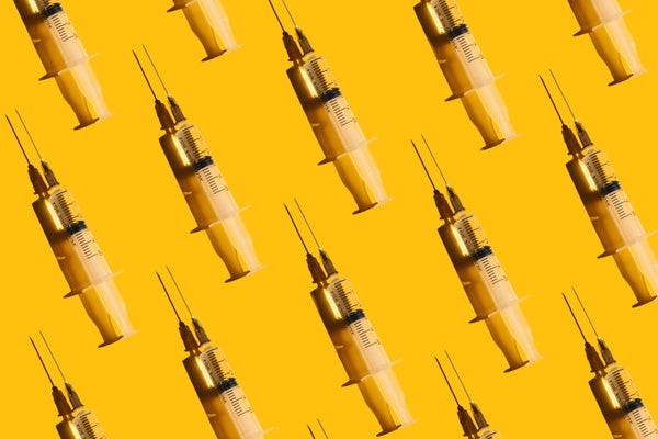 syringes on a yellow background to illustrate peptide injections for wellness