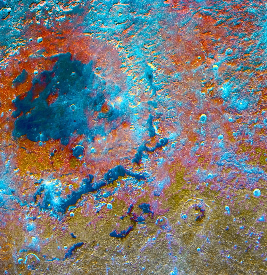 A hypersaturated image of Mare Orientale shows vivid oranges and blues