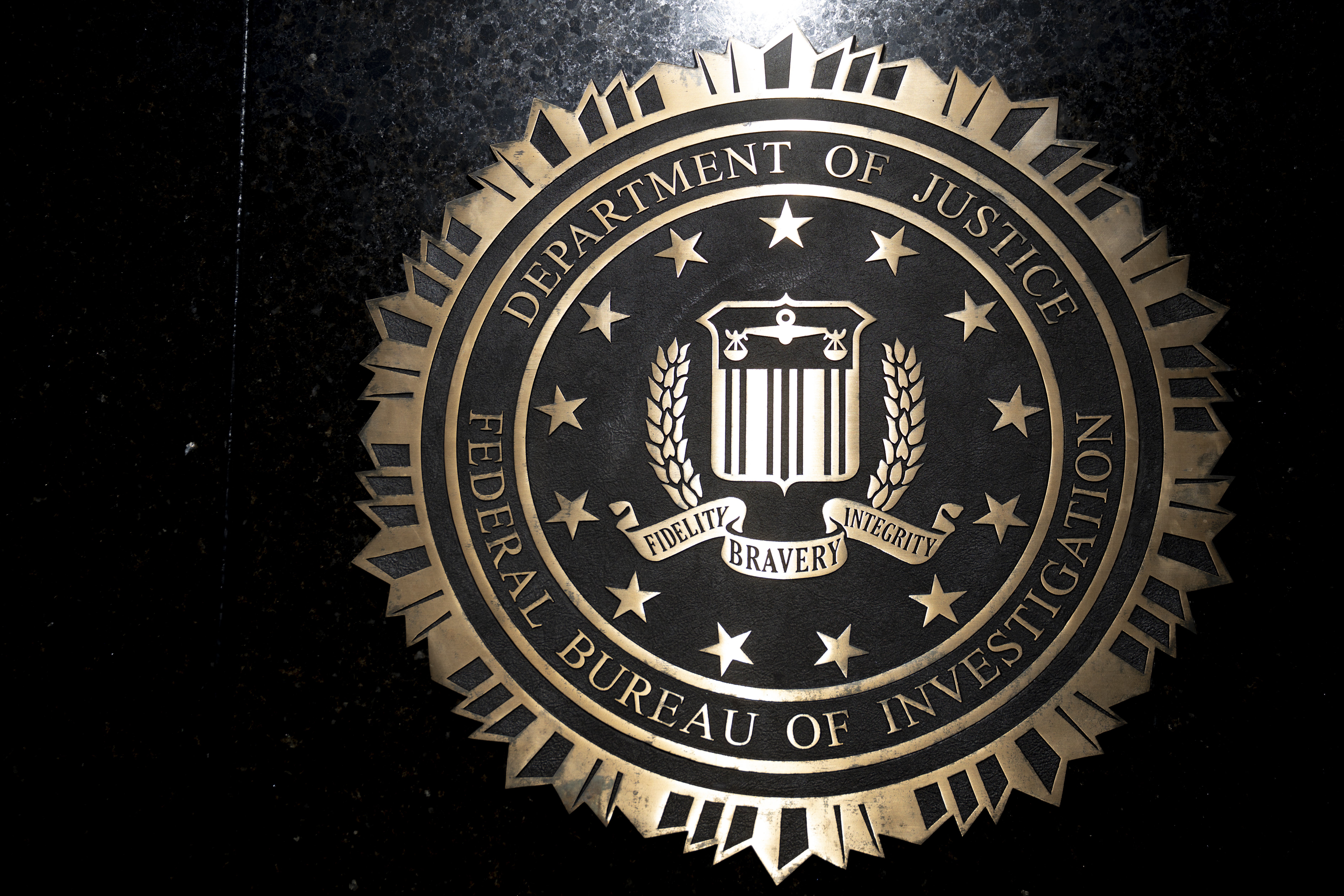 FBI logo against a dark background.