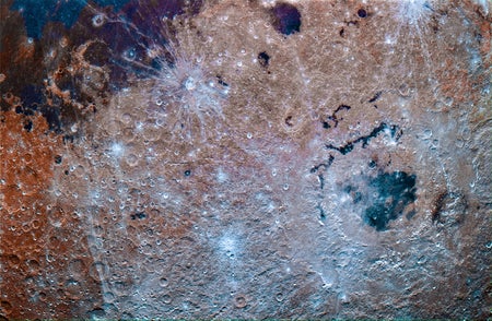 A closeup image of the lunar surface near Mare Orientale shows vibrant hues of purples and blues