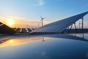 Solar panels with the sunset behind them
