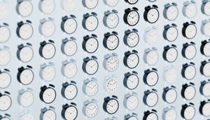 An image of a wall full of clocks.